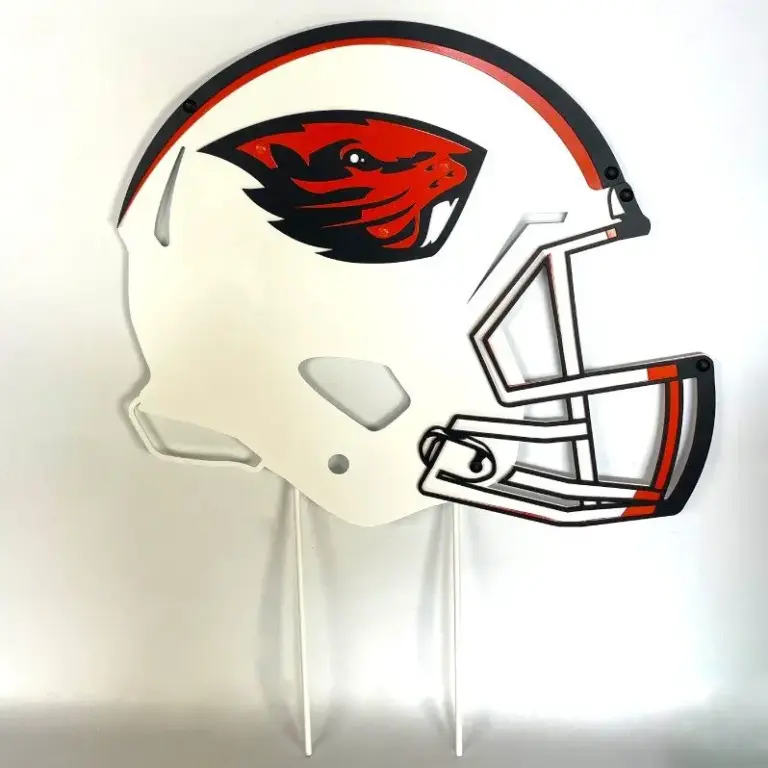Oregon state football helmet on stakes